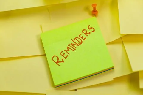 Stack of Yellow Sticky Notes with Reminders Stock Photos