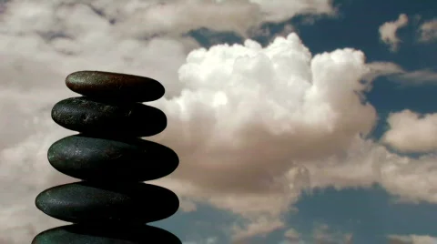 Stack of Zen rocks against cloud timelapse - HD Stock Footage 569771