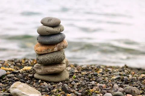 Stack of zen stones on beach. Pyramid of stones on the beach. Zen meditation Stock Photos