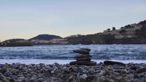 A stack of zen stones at sea Stock Footage 122197339