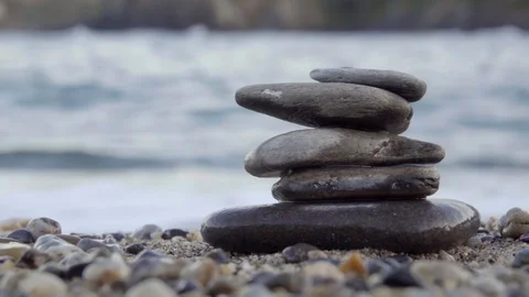 A stack of zen stones at sea Stock Footage 122197539
