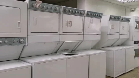 Stackable Commercial Laundry Washer and Dryer in an Appliances Store Stock Footage 162999852