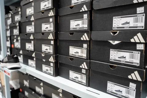 Stacked Adidas shoe boxes inside outlet store. Toronto, Canada - July 13, 2026. Stock Photos