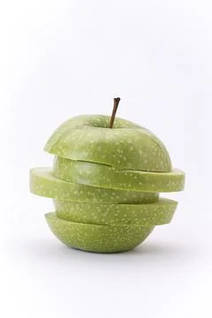 Stacked apple slices. Stock Photos