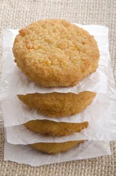 Stacked atlantic cod fishcake on jute Stock Photos