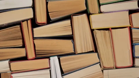 Stacked Books Background Representing Education and Lifelong Learning 库存影片 334773634