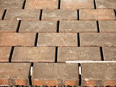 Stacked bricks forming paving pattern for construction background 写真素材