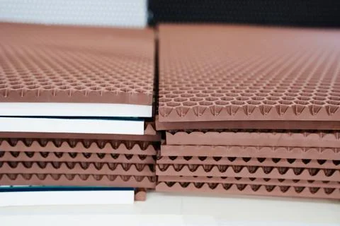 Stacked brown EVA sheets side texture Stock Photos