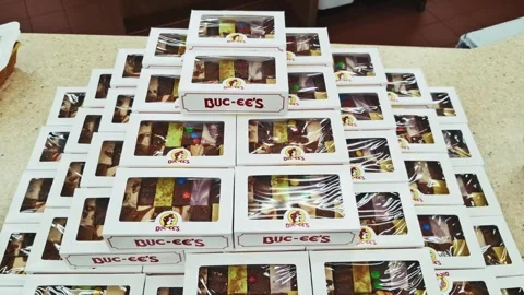 Stacked Buc ee’s fudge boxes on display counter Stock Footage 315759255