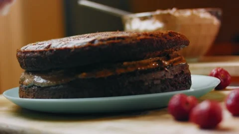 Stacked chocolate sponge layers ready for final frosting, 4K Stock Footage 341121589