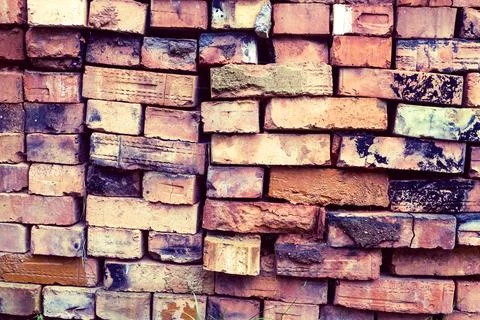Stacked clay bricks showcasing a rustic texture and earthy colors at a Stock Photos