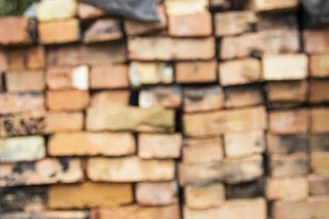 Stacked clay bricks showcasing a rustic texture and earthy colors at a Stock Photos