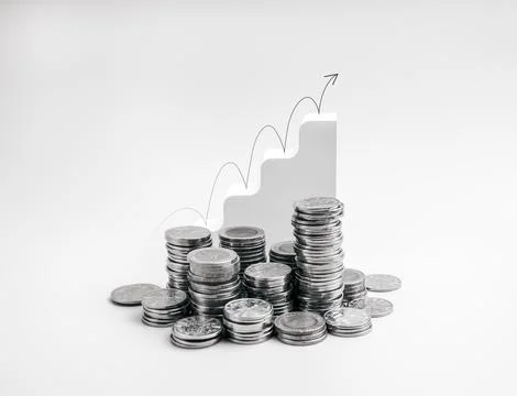 Stacked coins with white step graph and upward jumping arrow on white backg.. Stock Photos