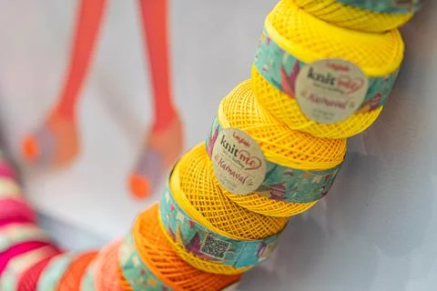 Stacked colorful cylindrical objects at fair, vibrant colors yellow, green,.. Stock Photos