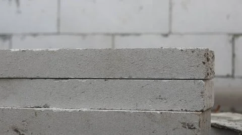 Stacked concrete blocks with rough texture at construction site. Industrial.. Stock Photos