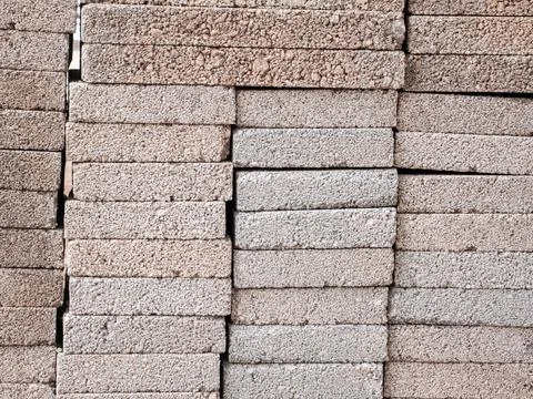 Stacked concrete construction blocks background texture Photos