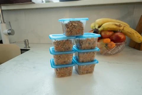 Stacked containers hold breakfast oats on a clean countertop Stock Photos
