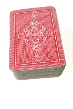 Stacked deck of face down cards isolated on white background Stock Photos