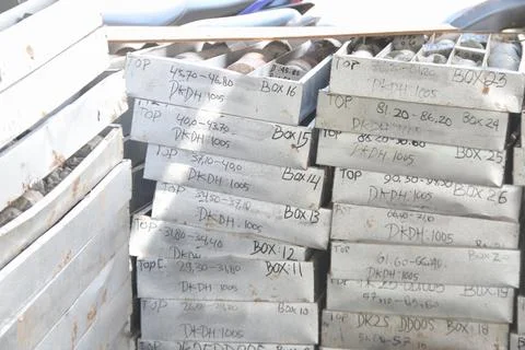 Stacked drill core boxes from gold exploration site Stock Photos