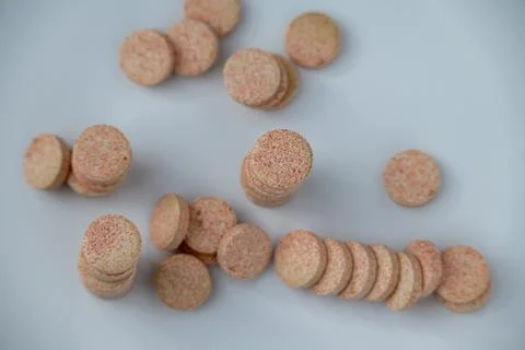 Stacked Effervescent Vitamin C Tablets on Blue Background Stock Photos