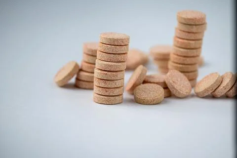 Stacked Effervescent Vitamin C Tablets on Blue Background Stock Photos