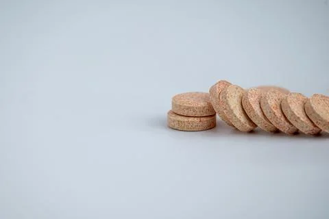 Stacked Effervescent Vitamin C Tablets on Blue Background Stock Photos