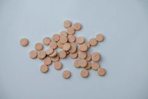 Stacked Effervescent Vitamin C Tablets on Blue Background Stock Photos