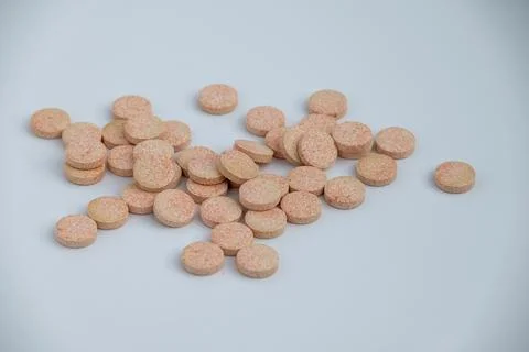 Stacked Effervescent Vitamin C Tablets on Blue Background Stock Photos