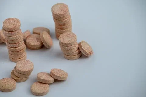 Stacked Effervescent Vitamin C Tablets on Blue Background Stock Photos