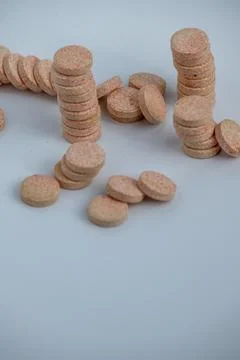 Stacked Effervescent Vitamin C Tablets on Blue Background Stock Photos
