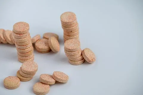 Stacked Effervescent Vitamin C Tablets on Blue Background Stock Photos