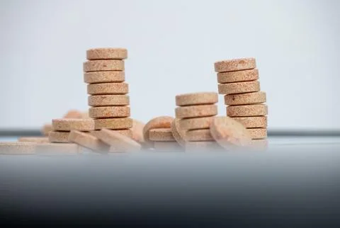 Stacked Effervescent Vitamin C Tablets on Blue Background Stock Photos
