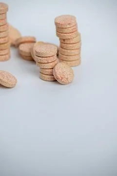 Stacked Effervescent Vitamin C Tablets on Blue Background Stock Photos