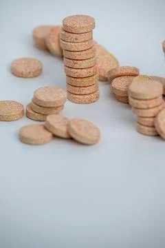 Stacked Effervescent Vitamin C Tablets on Blue Background Stock Photos