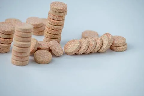 Stacked Effervescent Vitamin C Tablets on Blue Background Stock Photos