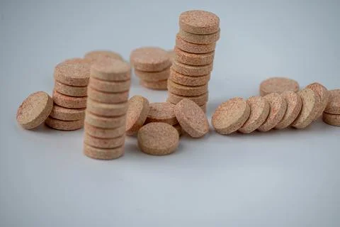 Stacked Effervescent Vitamin C Tablets on Blue Background Stock Photos
