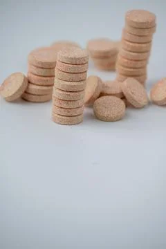 Stacked Effervescent Vitamin C Tablets on Blue Background Stock Photos