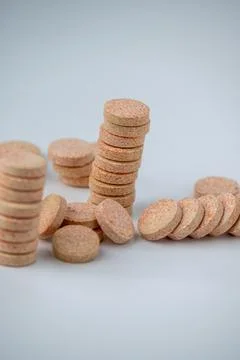 Stacked Effervescent Vitamin C Tablets on Blue Background Stock Photos