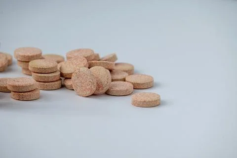 Stacked Effervescent Vitamin C Tablets on Blue Background Stock Photos
