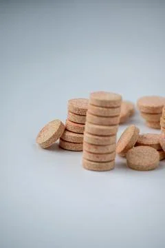 Stacked Effervescent Vitamin C Tablets on Blue Background Stock Photos