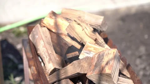 Stacked firewood on rusty cart Stock Footage 342397835