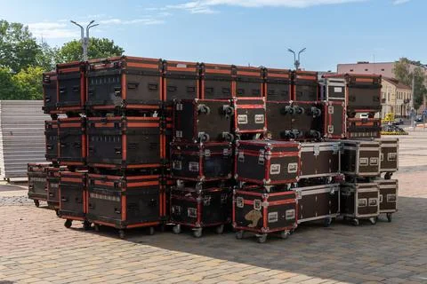 Stacked flight case and road case equipment on wheels Stock Photos