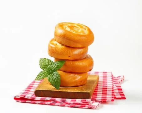 Stacked glazed donuts with mint leaf Stock Photos