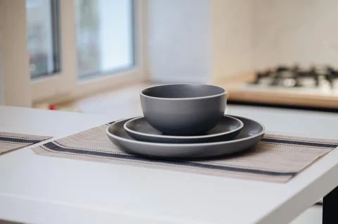 Stacked gray ceramic bowls on kitchen table, minimal home tableware Stock Photos