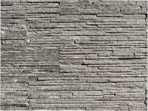 Stacked grey thin slate bricks background photograph. Stock Photos