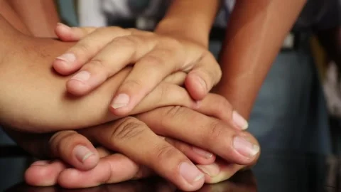 Stacked Hands Symbolize Cooperation Vídeo Stock 346874307