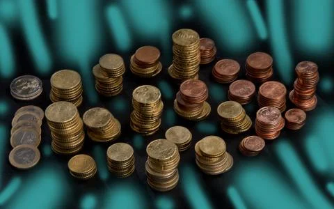 Stacked heaps of coins Stock Photos