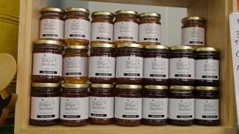 Stacked Honey Jars on Display at Sydney Market Stall, Close Up at Eveleigh Stock Footage 345804078