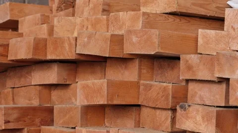 Stacked lumber beams creating an abstract pattern for construction and Stock Footage 346310356