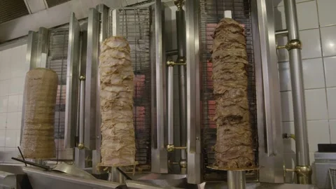 Stacked Meat Rotisseries Cooking in Restaurant Kitchen, Sydney, Australia Stock Footage 345808652